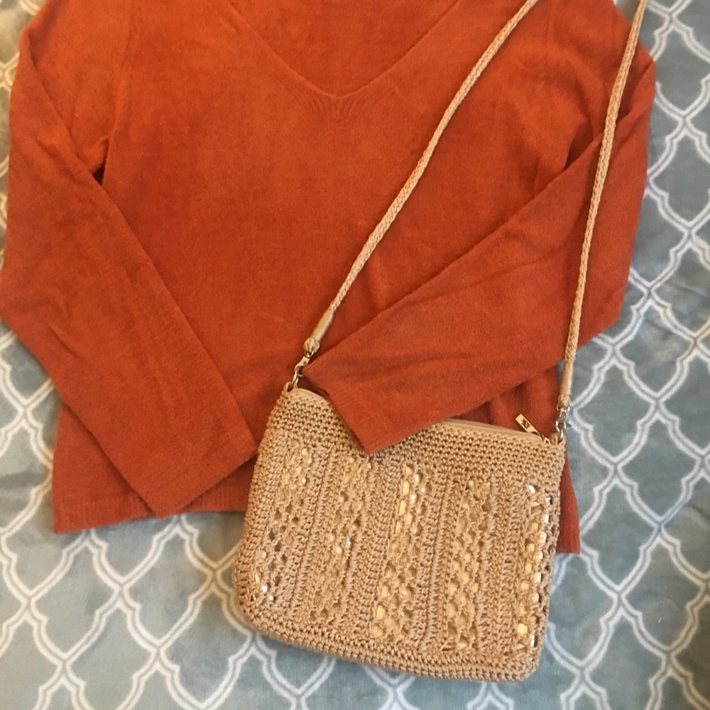 Crochet bag with adjustable strap.